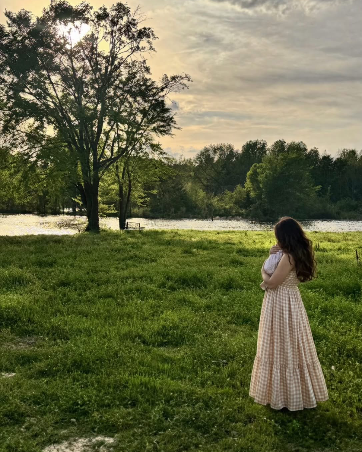 Kayla at the creek at golden hour, holding baby Savannah